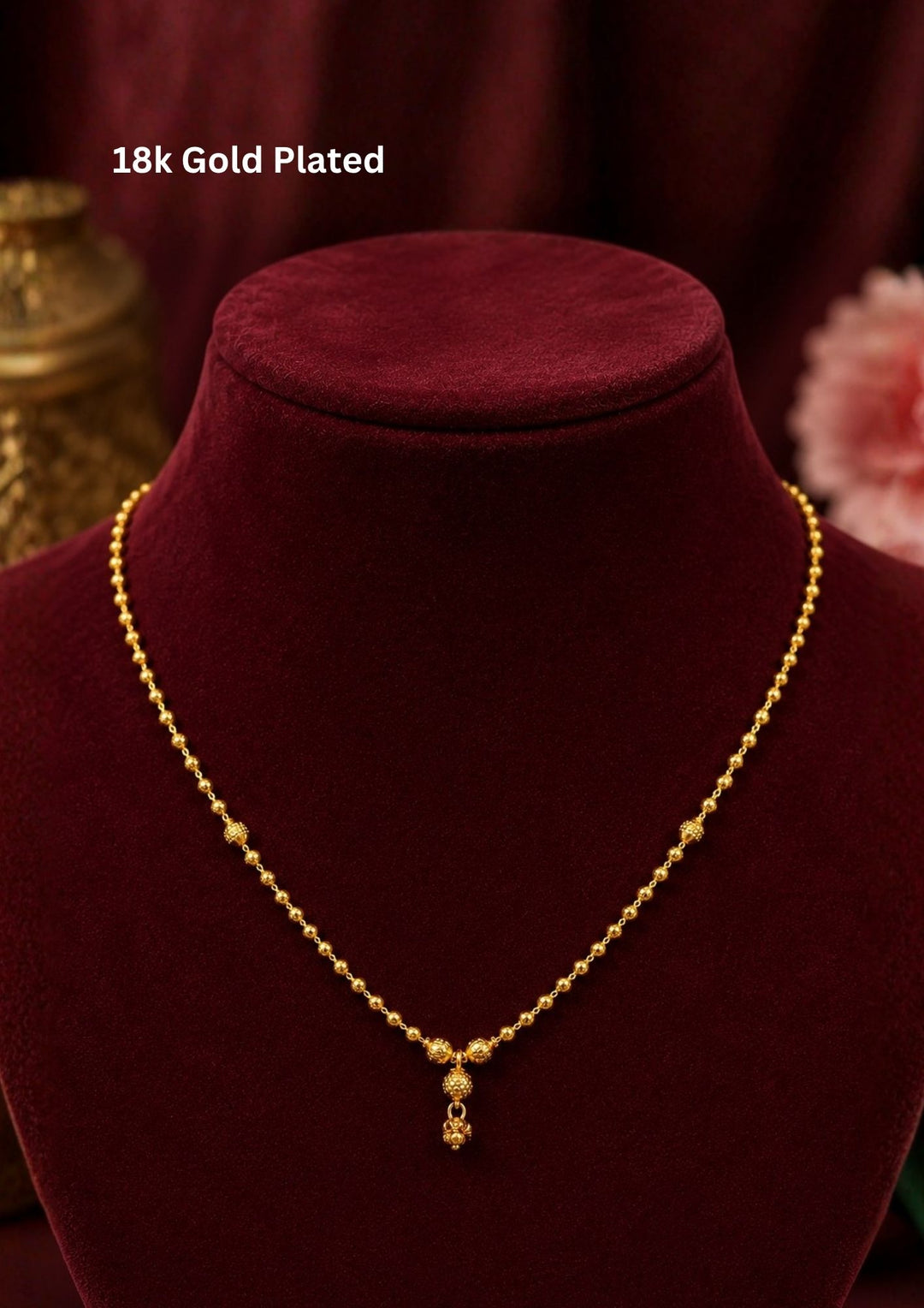 Minimalist gold plated necklace showcasing intricate textured bead detailing with a graceful drop pendant, perfect for daily wear, office wear, festive occasions, weddings, and traditional styling.