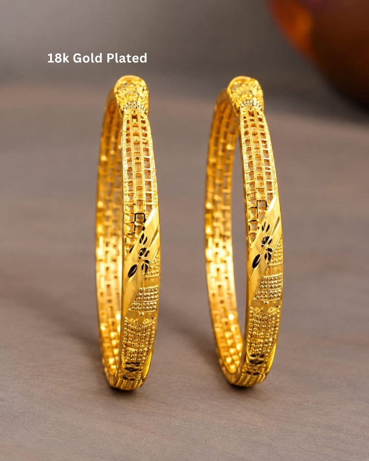 18K gold plated bangles featuring intricate geometric patterns, textured detailing, and black floral accents in an elegant traditional design.