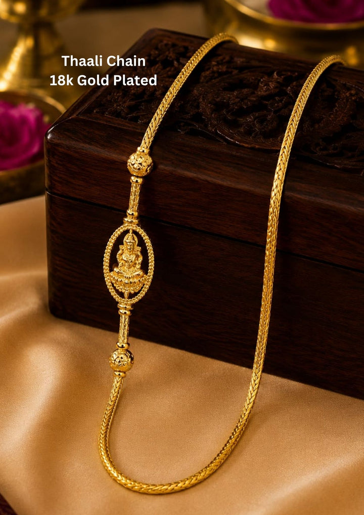 18K gold plated thalli chain featuring an elegant oval Lakshmi pendant with decorative gold bead accents and premium craftsmanship. ideal for festive and everyday ethnic wear.