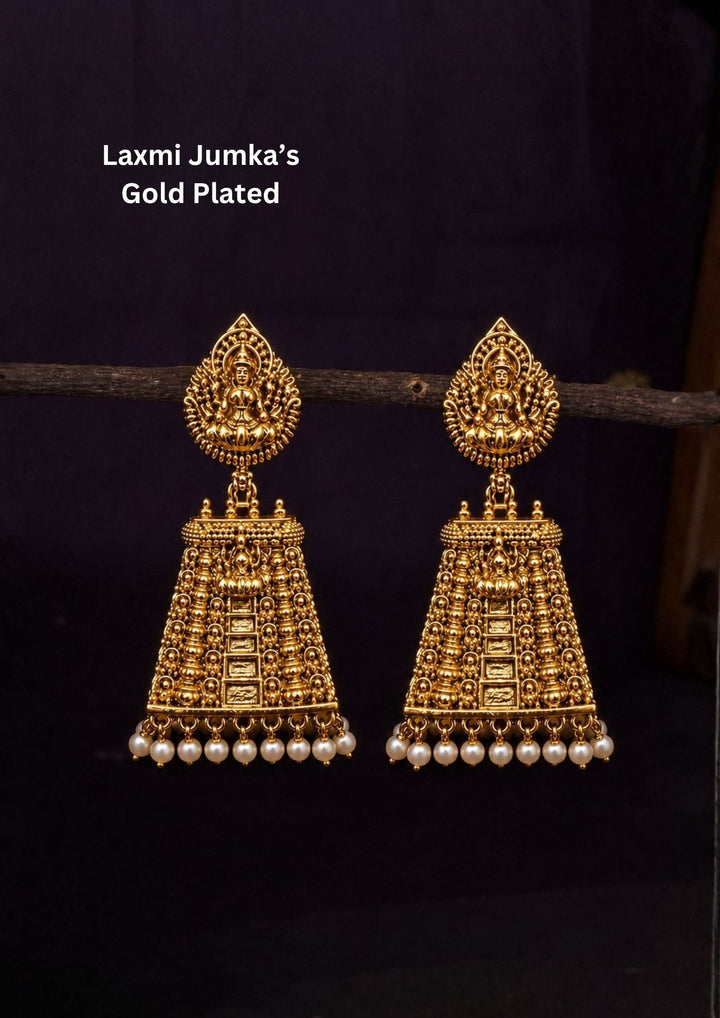 Gold Plated Laxmi earrings designed with detailed temple design, antique finish, and pearl drops. Perfect for weddings, festivals, sarees, and ethnic outfits.