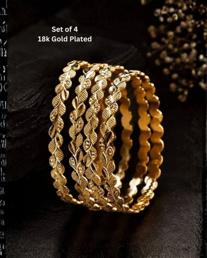 Four slim gold-plated rings stacked together Classic gold plated bangles with intricate engraved detailing for a timeless traditional look. Perfect for parties, office wear and it comes with anti tarnish color, skin friendly and sweat proof.