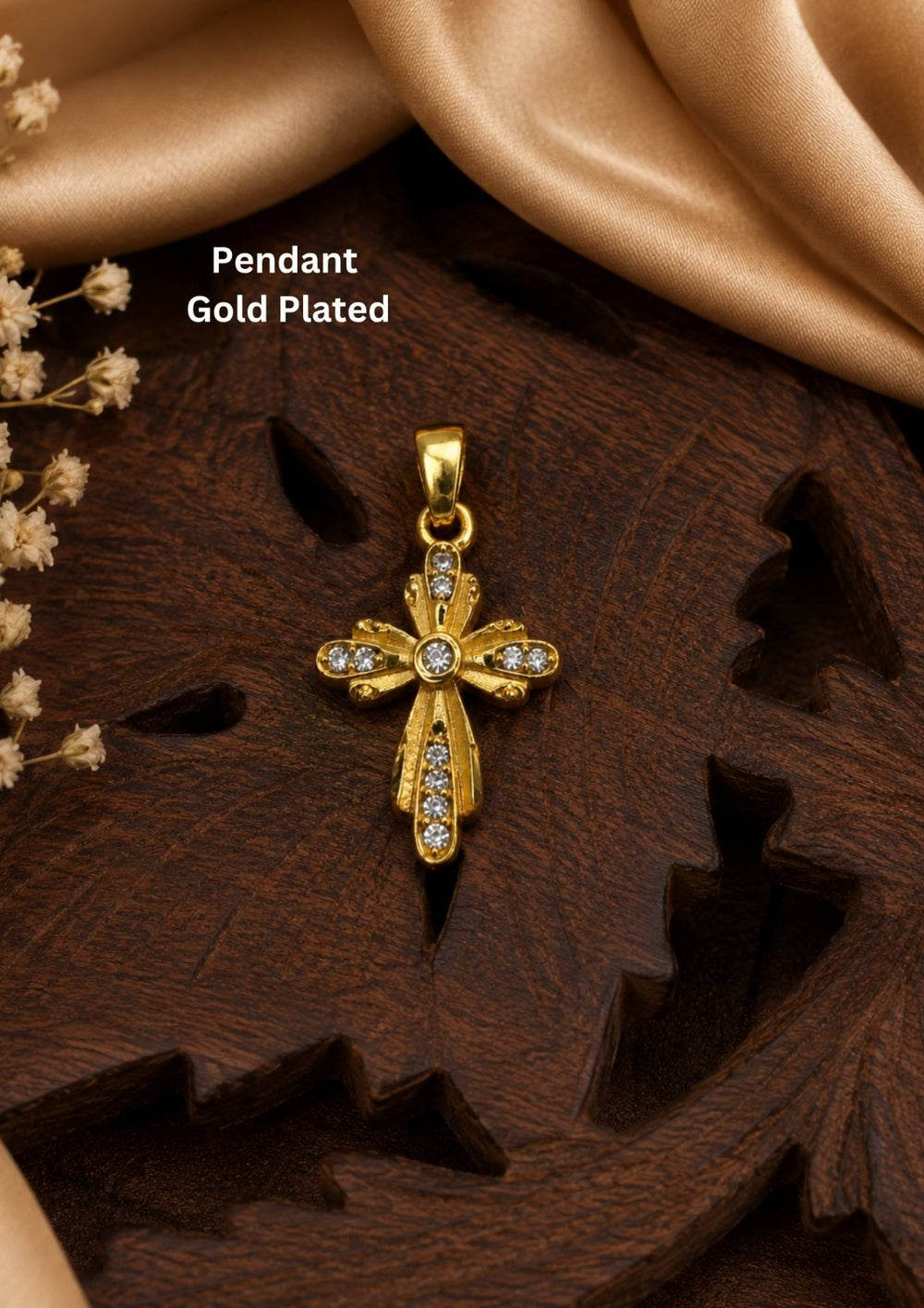 The cross has a stylized, vintage-inspired design with floriated or flared edges. It is embellished with small, clear sparkling stones (likely cubic zirconia or crystals) set along the arms of the cross and clustered at the center, giving it an eye-catching shimmer.