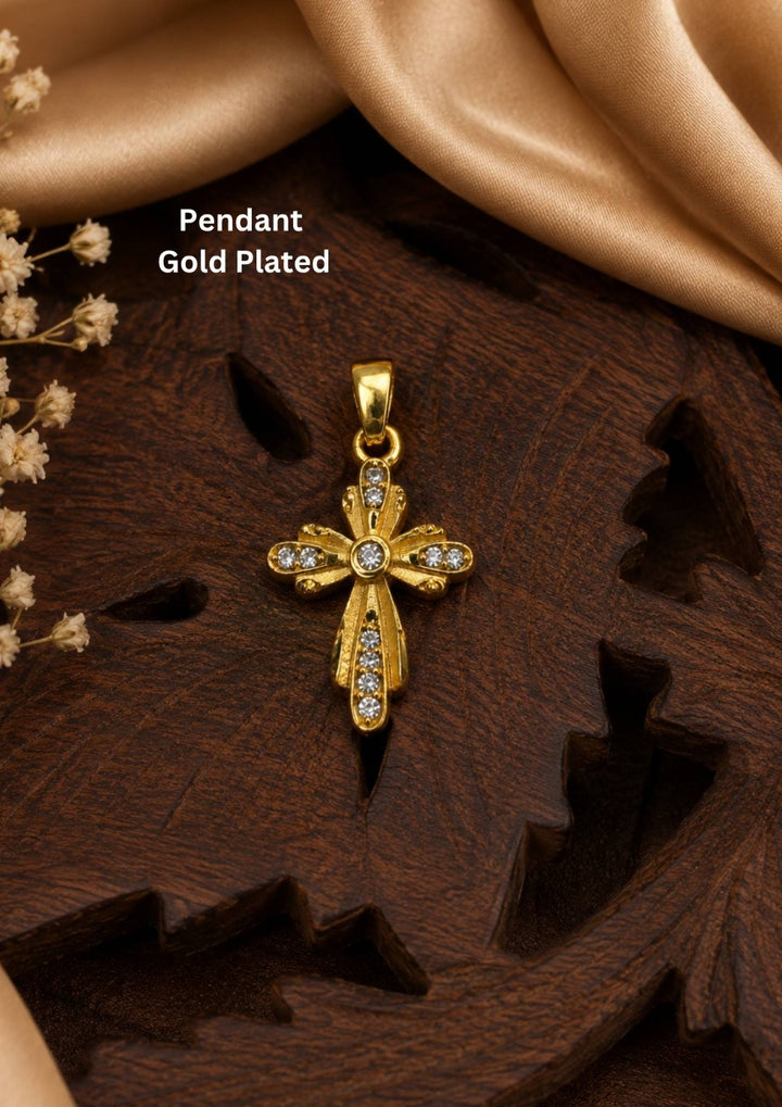 The cross has a stylized, vintage-inspired design with floriated or flared edges. It is embellished with small, clear sparkling stones (likely cubic zirconia or crystals) set along the arms of the cross and clustered at the center, giving it an eye-catching shimmer.