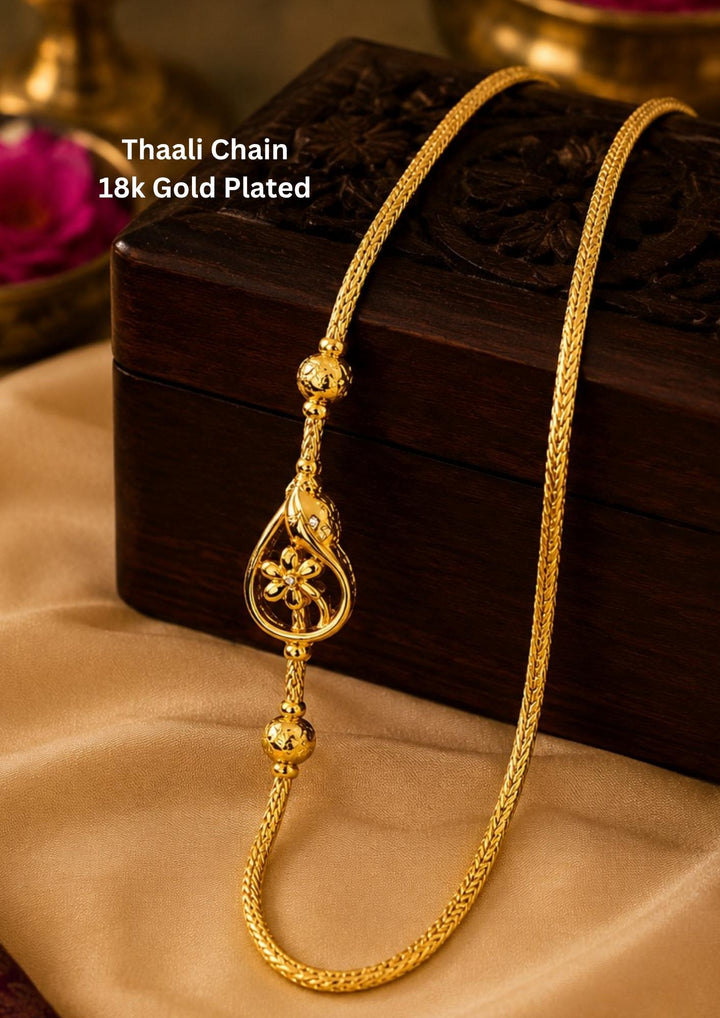18K gold plated thalli chain featuring an elegant floral pendant with decorative gold bead accents and premium craftsmanship for festive and daily wear , office wear.