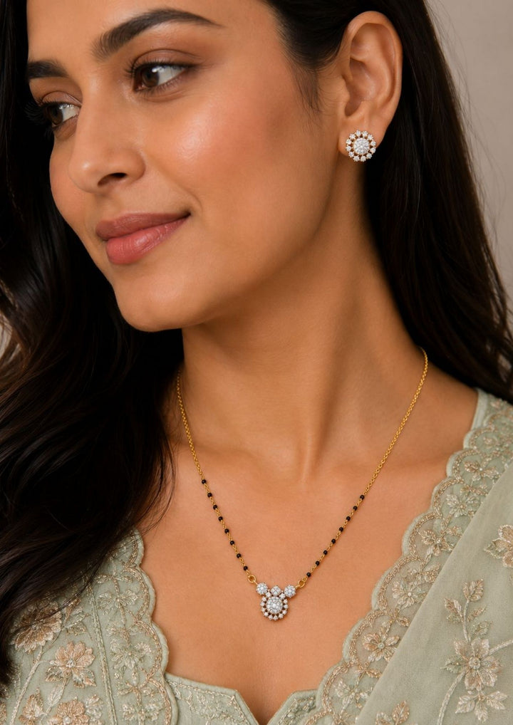 south indian modern women wearing a Zircon diamond 18k gold plated Mangalsutra with studs desigmed in floral patteren with zircon stones perfect for modern look and dailywear, anti fade color
