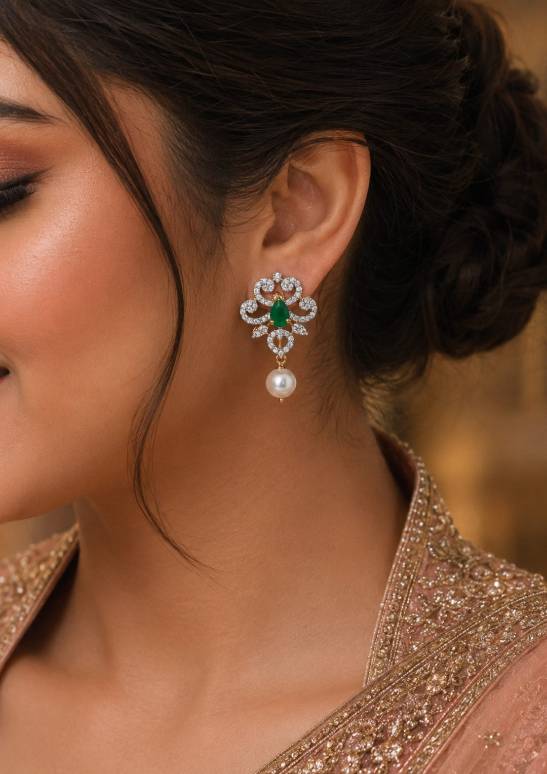 South indian women wearings a zircon diamond gold plated 4 in 1 green jhumkas and can be used like 4 ways and for all the parties cane used this are anti faded and skin safe and can be used for parties , festivals and weeding's 
