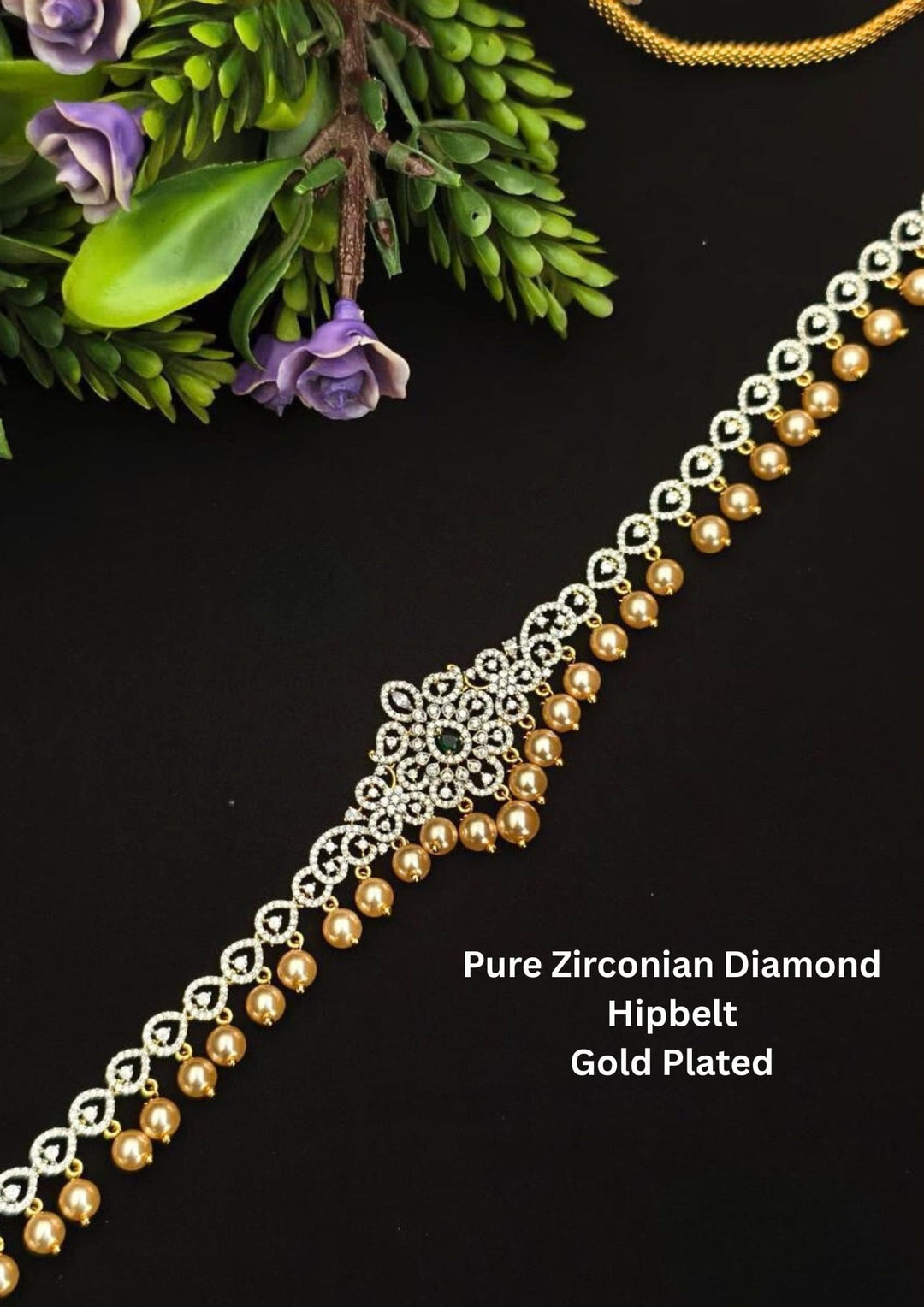 A gold-colored hip belt with American diamond