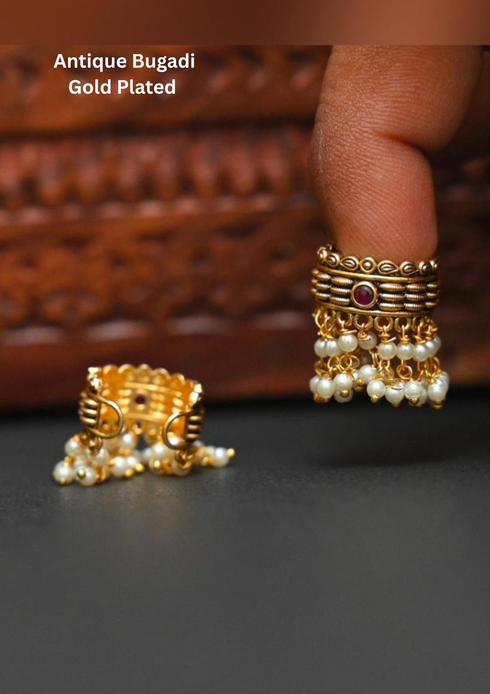 Gold-plated bugadi with pearl detailing and in picture clearly shows how it looks back and front  image and it comes with Red gemstone and looks very elegant and can be used for festivals and weeding's   