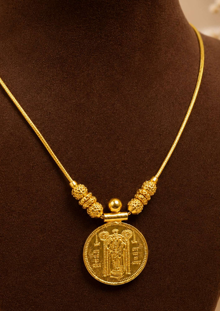 Exquisite God Balaji gold-plated coin necklace featuring intricate motif carvings and ruby-colored stone accents. Ideal for weddings, festive occasions, temple visits, traditional sarees, and bridal gifting.