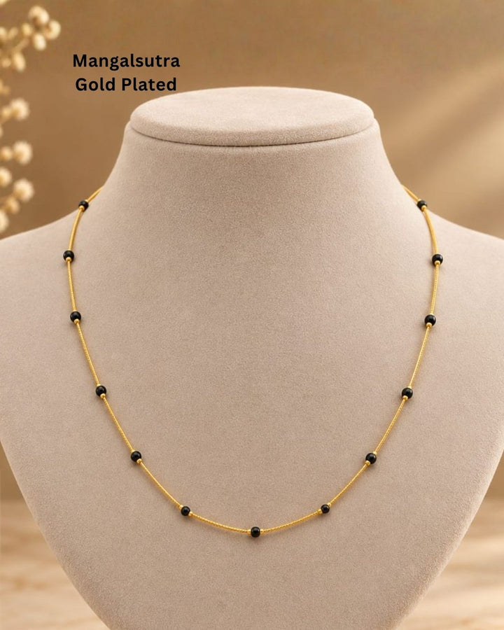 Beautiful simple Mangalsutra featuring a delicate gold plated chain with classic black beads. Perfect for daily wear, office wear, traditional outfits, festive occasions, and gifting.