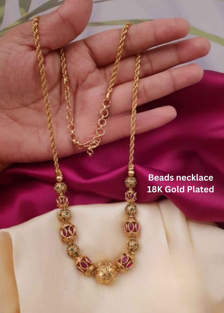 Gold necklace with beads