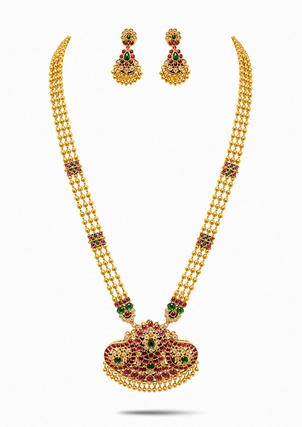 Gold necklace Set with a detailed pendant and earrings  on a white background with green and red stones come with jadau kundan in necklace set with beads and in pendent shows clear design and in detailed shown in picture it will not fade color and water proof can used for festivals, bridals, and weeding's  