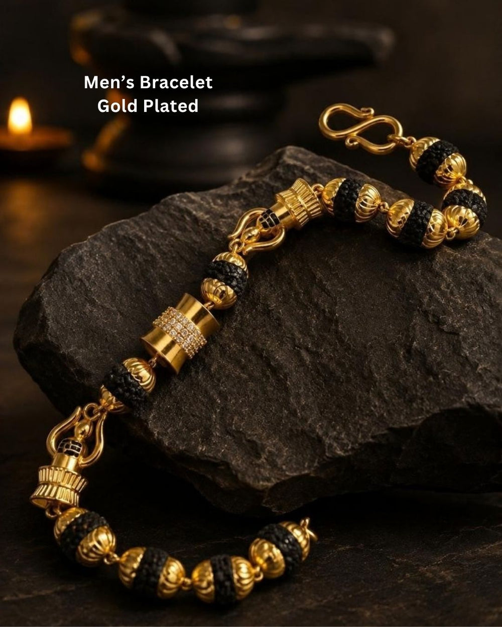 Elegant gold plated men’s bracelet featuring black textured beads, ornate gold accents, and a detailed clasp design, perfect for daily wear, festive occasions, and traditional looks.