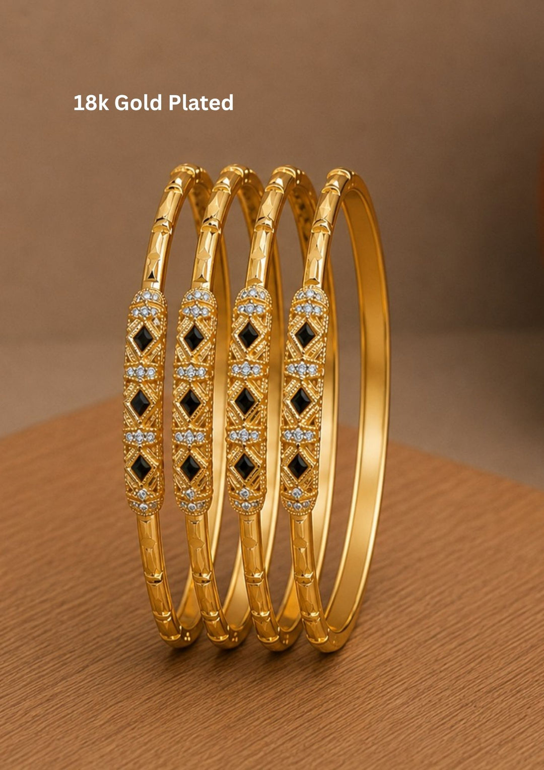 Elegant 18K gold plated bangles featuring sparkling zircon stones with striking black stone accents. A graceful design perfect for festive, party, and traditional occasions.
