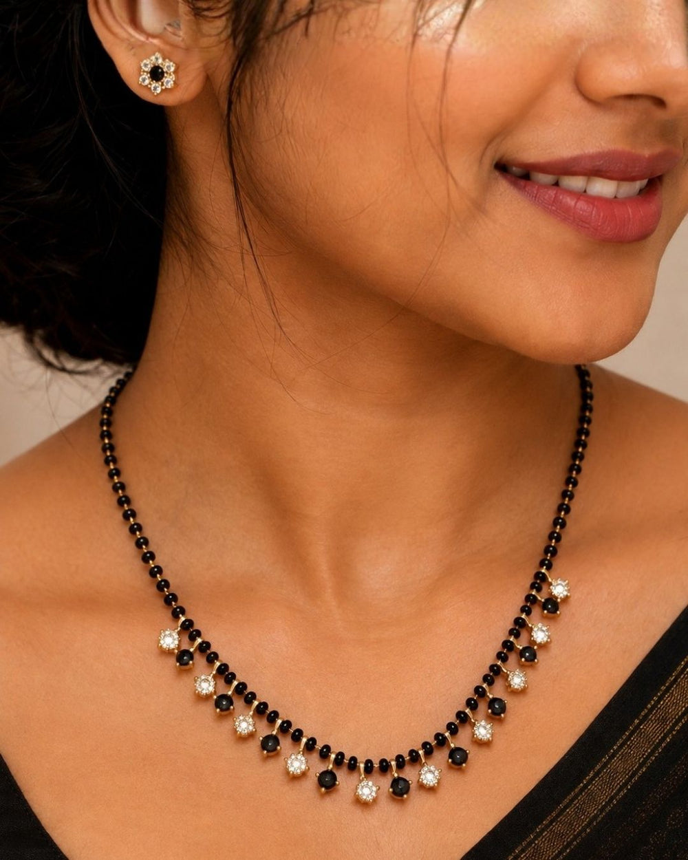 south indian women Zircon diamond 18k gold-plated necklace and earrings designed with single line nallapusalu black beads with white and black stones hanging and with matching studs perfect for daily wear and office wear and its anti fade color