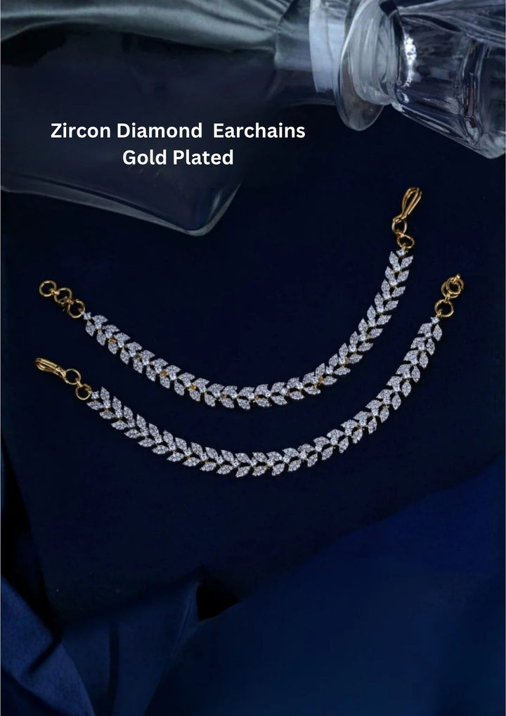 gold plated mattilu ear chains showcasing a continuous laurel leaf botanical pattern. Each individual leaf cluster is formed by two angled marquise-cut pure Zirconian diamonds facing outward, complete with a secure golden S-hook at one end and a multi-ring loop connector at the other.