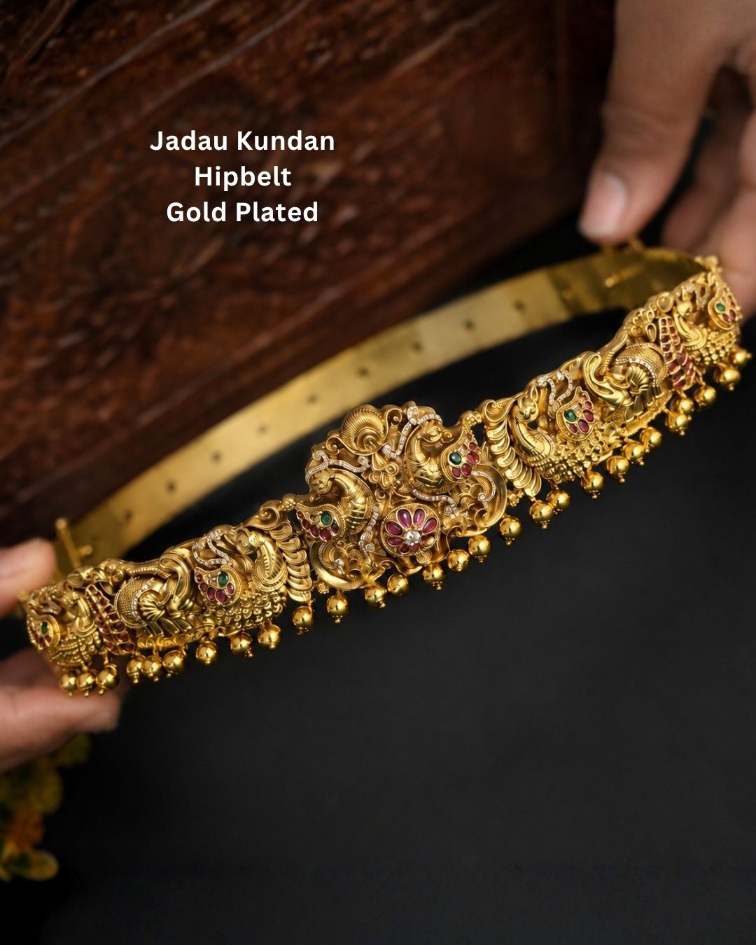 Beautiful temple-style gold plated hip belt featuring ornate peacock motifs, floral stone detailing, and hanging gold beads. Perfect for traditional sarees, festive occasions, weddings, Bharatanatyam performances, and special events.