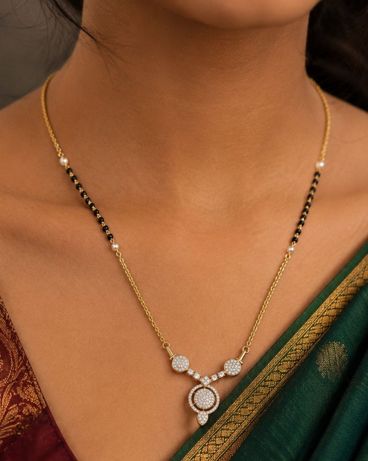 Beautiful black beads gold plated necklace set featuring a delicate chain, pearl accents, sparkling circular pendant, and matching earrings. Perfect for daily wear, festive occasions, traditional outfits, parties, and gifting.