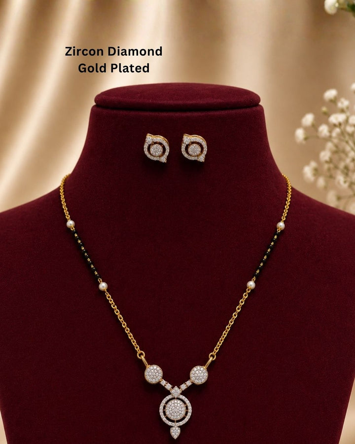 Beautiful black beads gold plated necklace set featuring a delicate chain, pearl accents, sparkling circular pendant, and matching earrings. Perfect for daily wear, festive occasions, traditional outfits, parties, and gifting.
