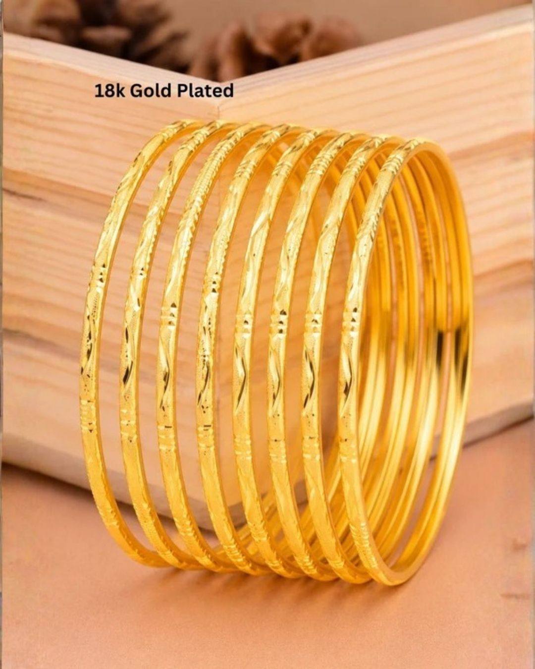 Beautiful set of eight 18K gold plated bangles crafted with elegant engraved traditional patterns.
Lightweight and comfortable for stacking or individual wear.
Perfect for weddings, festivals, daily wear, and ethnic outfits.
