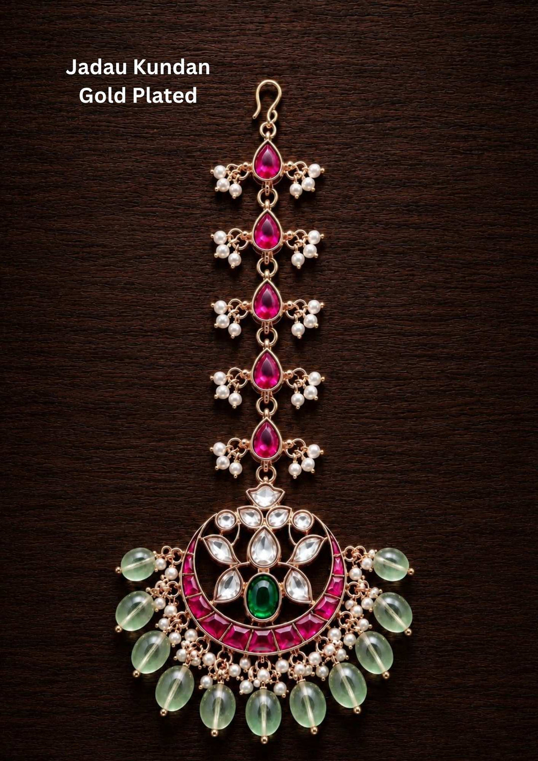 Gold plated traditional maang tikka hair accessory featuring a beautiful, structured centerpiece intricately set with shimmering white Jadau Kundan stones in a classic floral or geometric layout. The main pendant is designed to rest elegantly on the forehead, connected to a polished gold link chain, and is finished with a delicate row of hanging white pearl drops at the bottom for a timeless, regal look.