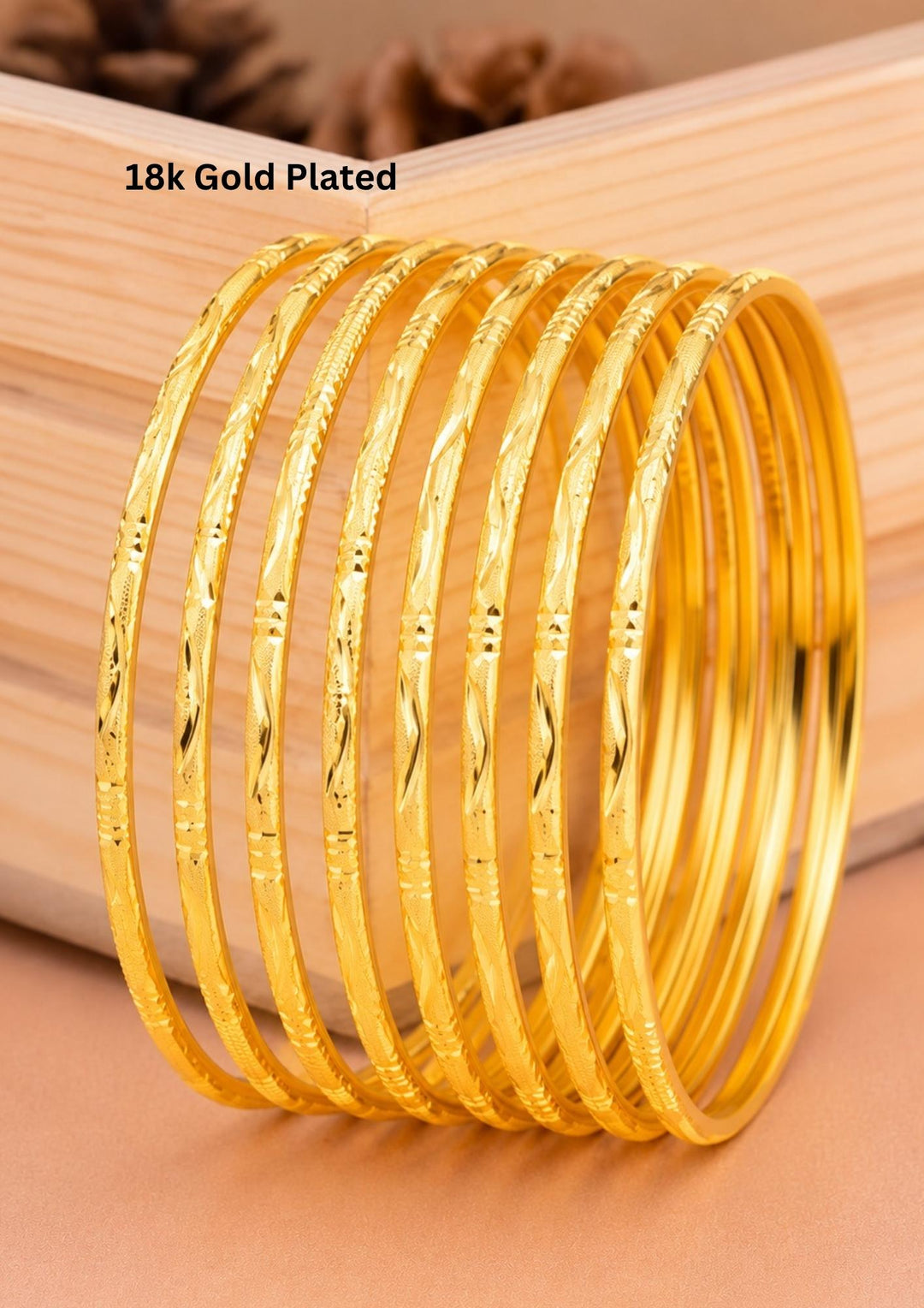 Beautiful set of eight 18K gold plated bangles crafted with elegant engraved traditional patterns.
Lightweight and comfortable for stacking or individual wear.
Perfect for weddings, festivals, daily wear, and ethnic outfits.