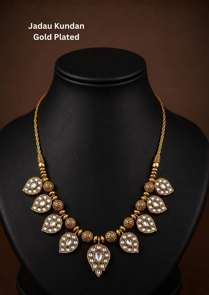 Beautiful Jadau Kundan gold plated necklace featuring pear-shaped kundan motifs, detailed gold beadwork, and elegant craftsmanship. Perfect for weddings, festivals, temple visits, traditional outfits, family functions, and premium gifting.