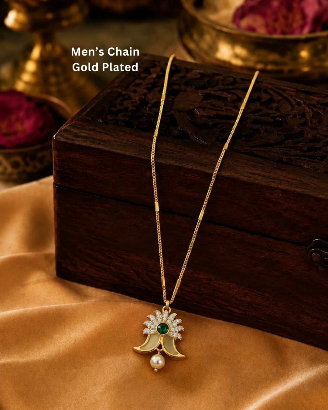 Gold plated Puligoru chain featuring a delicate floral pendant with a green center stone, white stones, and a single pearl drop.