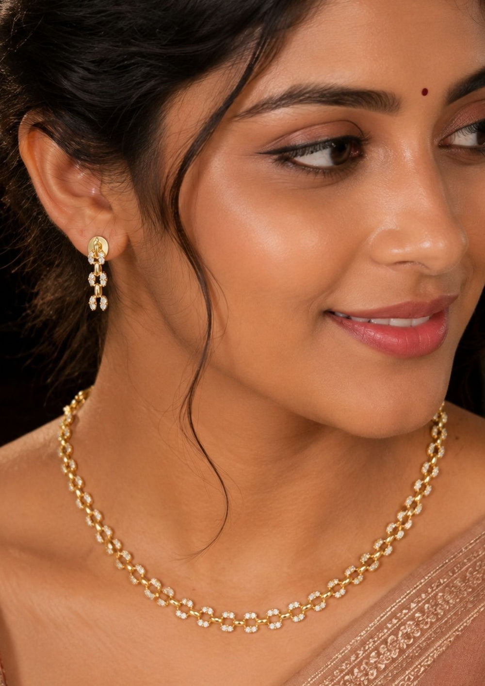 South Indian Woman styling a zircon diamond gold plated minimal necklace set with matching earrings. The jewelry features brilliant zircon stone detailing, elegant oval links and a lightweight comfortable finish perfect for sarees, western outfits and festive styling.