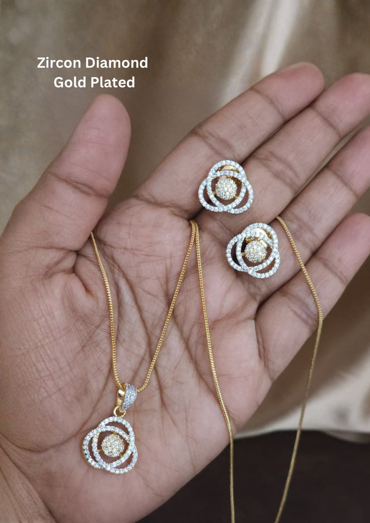 Zircon diamond gold plated pendant set design with sparkling white zircon stones in an elegant layered rose flower pattern with premium gold plated finish and sleek lightweight chain design. The pendant and earrings showcase a modern rose inspired circular floral model with micro zircon detailing at the center, giving a rich diamond look suitable for daily wear, office wear, parties, casual outings, festivals.