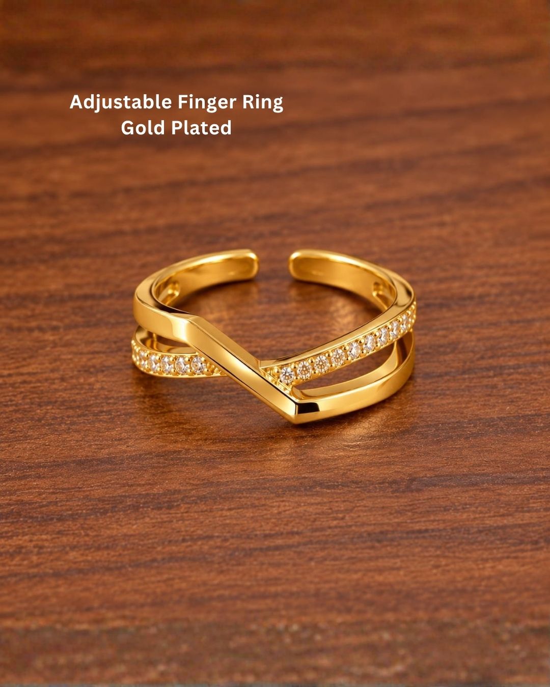 Stylish gold plated adjustable ring featuring an elegant criss cross design, sparkling stone accents, polished finish, and open adjustable band, perfect for daily wear, special occasions, and modern styling.
