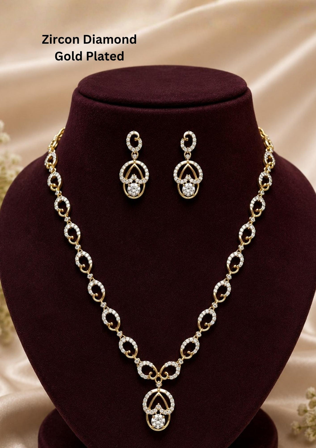 Stylish Zircon Diamond gold plated necklace set featuring an elegant oval link design with matching dangling earrings. Perfect for parties, weddings, festive occasions, and gifting.