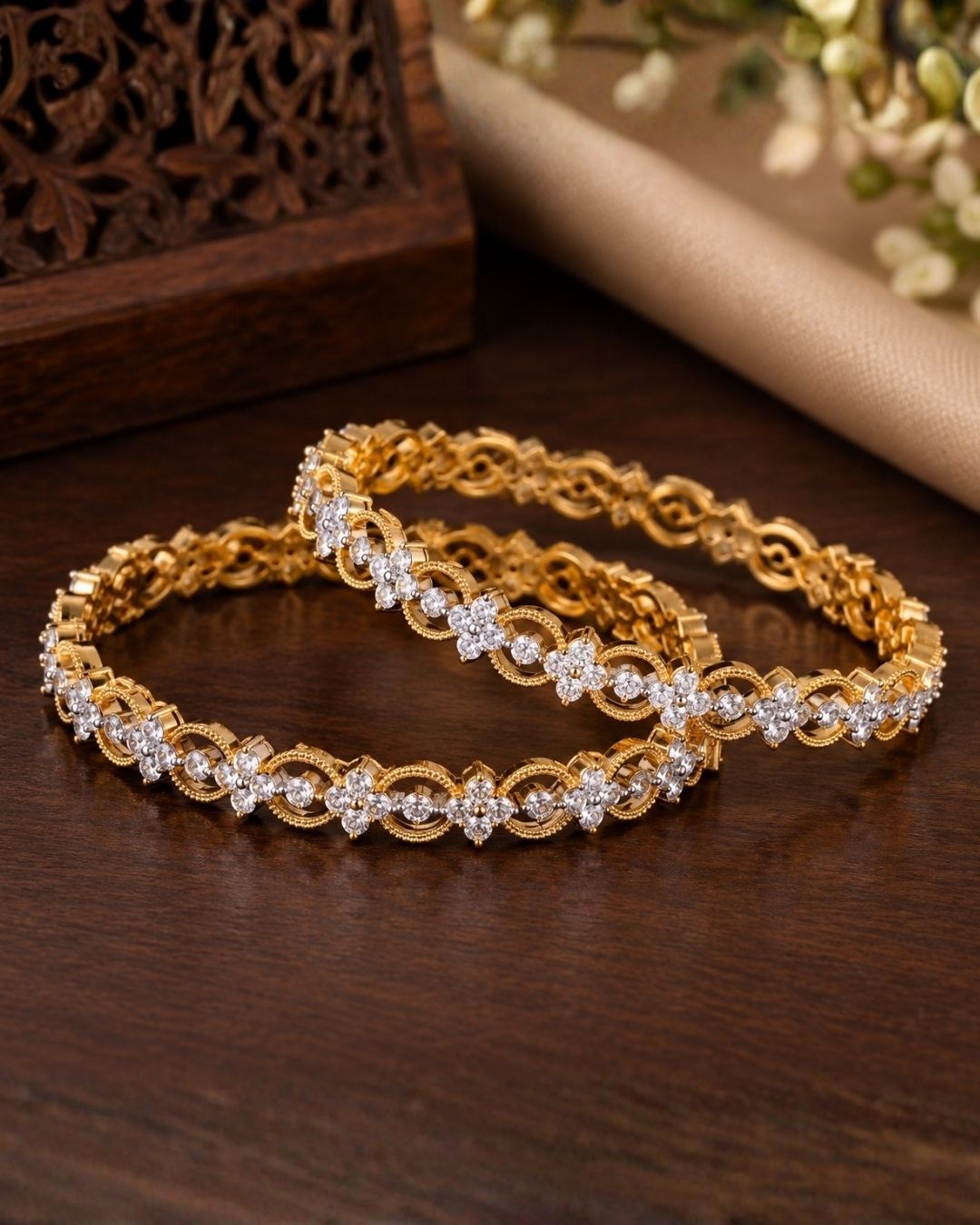 Close-up of hands wearing Gold-plated zircon diamond bangles comes with set of 2 and looks vert clear in picture how it looks and also in ide the bangle also in detailed and can be used for office ware , festivals and functions 