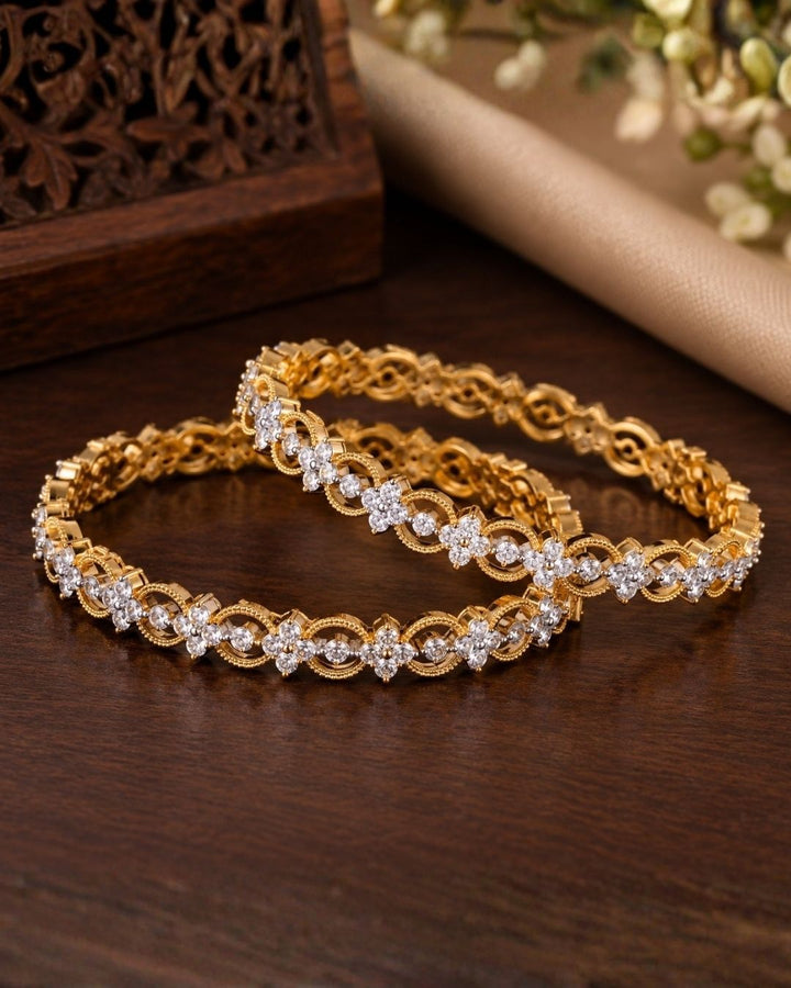 Close-up of hands wearing Gold-plated zircon diamond bangles comes with set of 2 and looks vert clear in picture how it looks and also in ide the bangle also in detailed and can be used for office ware , festivals and functions 