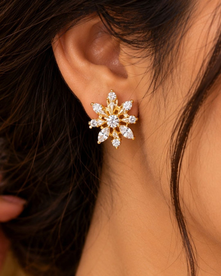 South Indian women wearing  Pure Zirconian Diamond Gold Plated long chain necklace and matching stud earrings set. The jewelry designed with floral pattern made of sparkling cube zirconia stones on a gold-plated base for festivals, temple visits, weddings, functions and dailywear