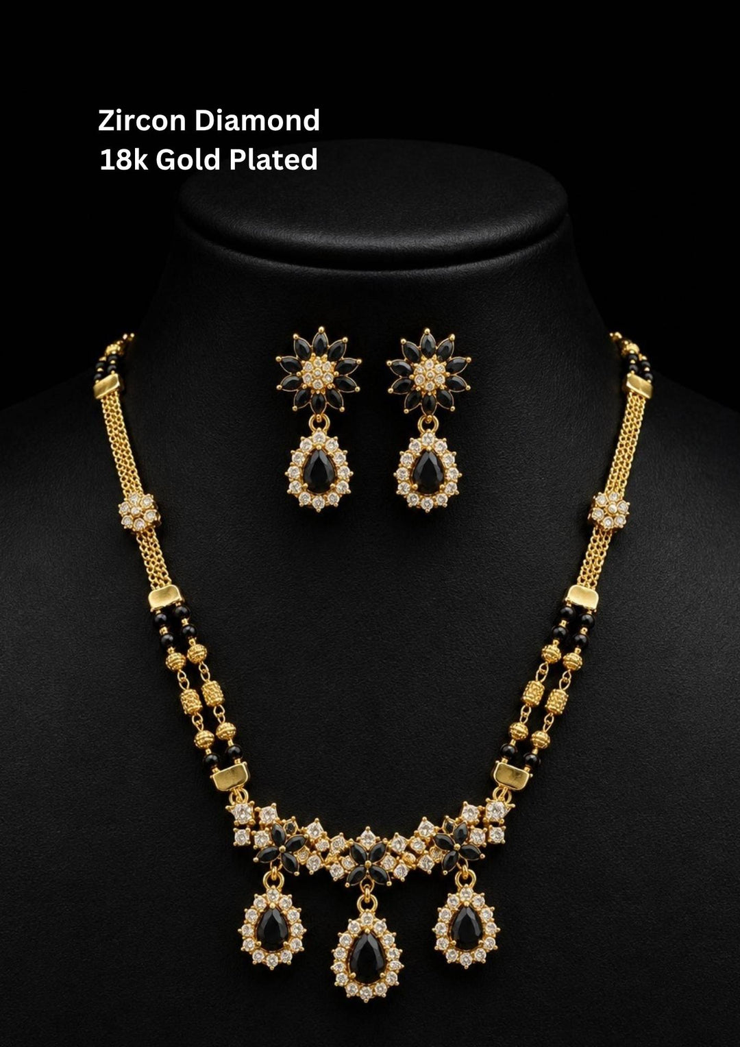 Elegant zircon diamond gold plated mangalsutra featuring black beads, sparkling CZ stones, and matching drop earrings for a graceful bridal look.