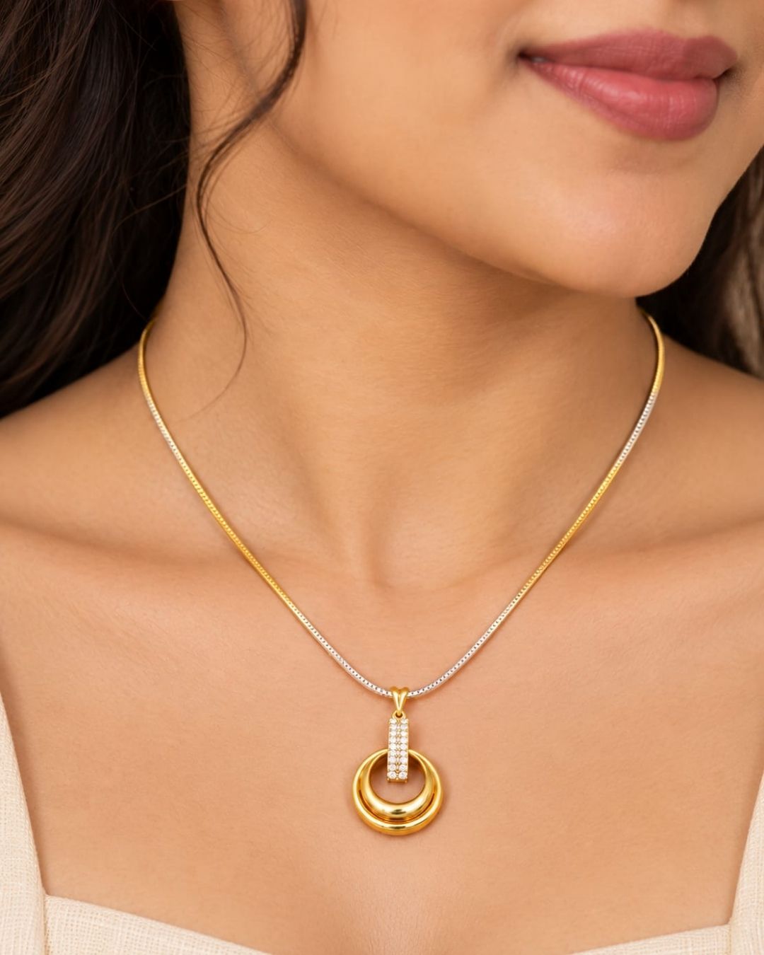 Stylish gold plated necklace set featuring a delicate chain, circular pendant with sparkling stone-studded detailing, and matching circular earrings, perfect for festive, party, and traditional occasions.