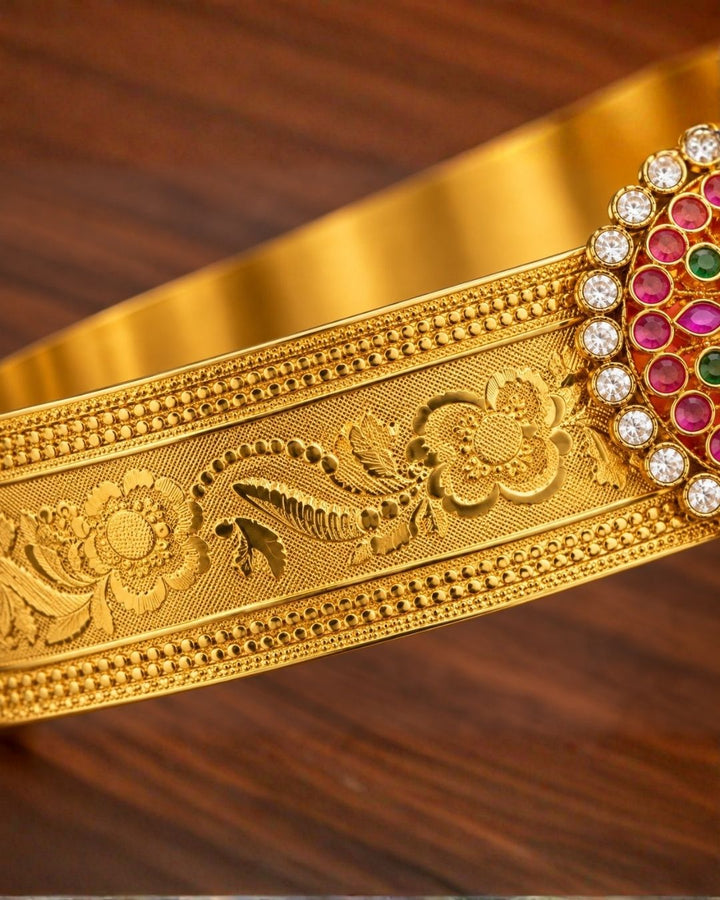 Beautiful gold plated designer hip belt featuring pink, green, and white stone accents with a removable floral pendant. Suitable for kids and adults, perfect for traditional outfits, festive occasions, dance performances, weddings, and special events.