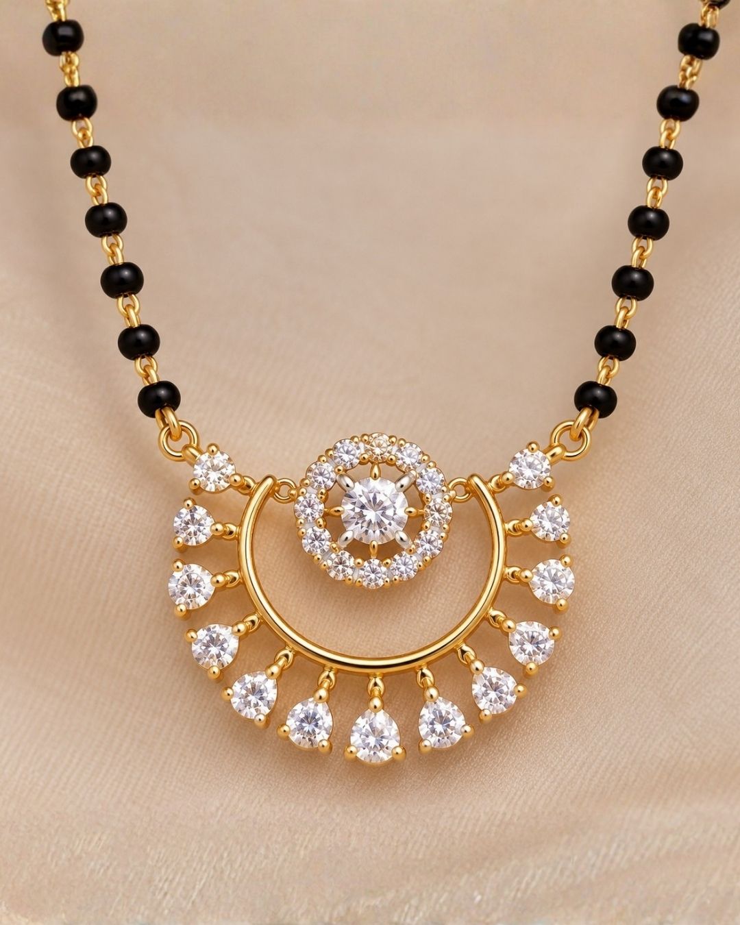South indian Womens Delicate gold plated black bead mangalsutra showcasing a circular zircon pendant with sparkling halo detailing and elegant dangling crystals, perfect for daily wear, office wear, festive occasions, and traditional styling.