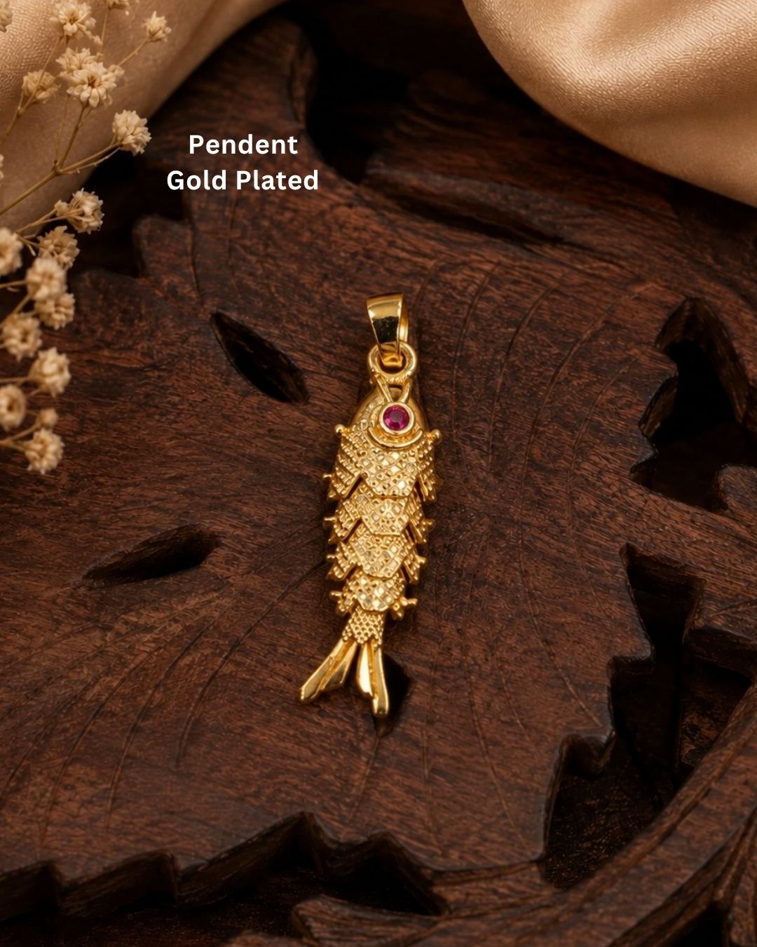 Beautiful fish design gold plated pendant featuring intricate traditional detailing and a vibrant red stone accent. Perfect for daily wear, festive occasions, traditional outfits, gifting, and special events.
