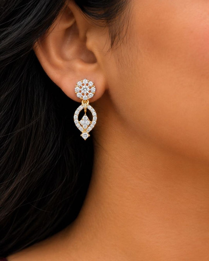 Beautiful gold plated necklace set featuring repeating loop-shaped links embellished with sparkling stones, a floral-inspired pendant, and matching drop earrings. Perfect for traditional wear, festive occasions, weddings, parties, and gifting.