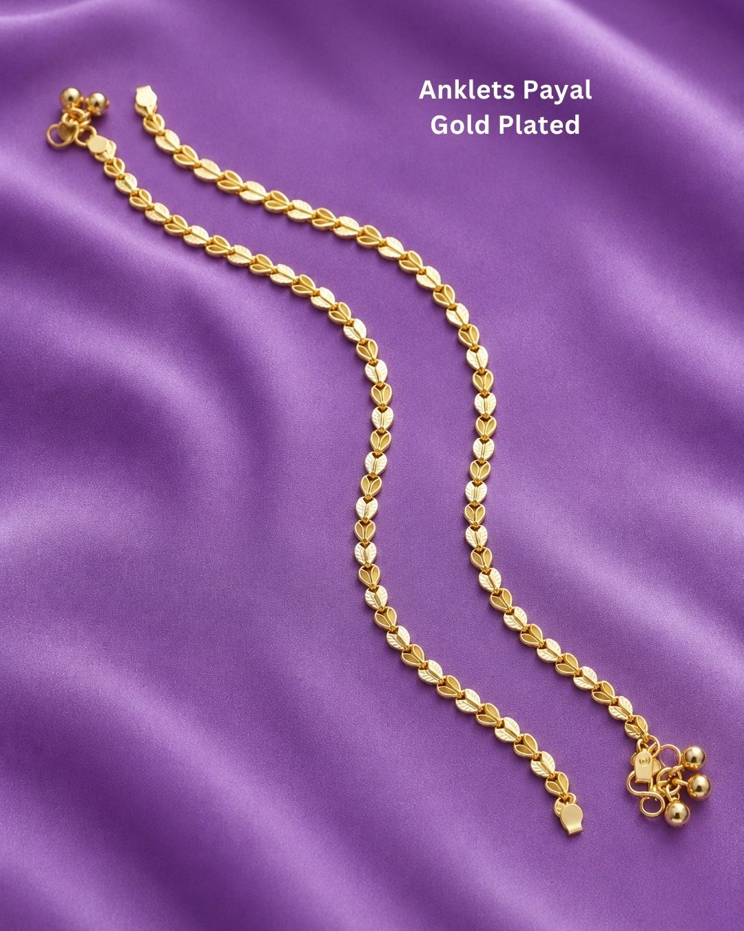 Beautiful gold plated payals featuring an intricate leaf-pattern chain with polished detailing and traditional ghungroo embellishments. Perfect for weddings, festive occasions, traditional wear, bridal styling, parties, and gifting.