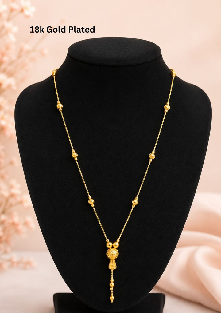 Beautiful 18K gold plated necklace featuring polished gold beads and an elegant designer ball pendant with graceful hanging chain detailing. Lightweight, stylish, and perfect for everyday elegance.