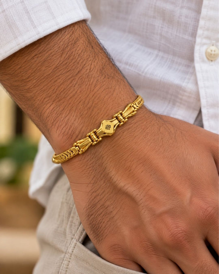 Premium gold plated men’s bracelet with a distinctive chevron link design and detailed central accent, suitable for everyday wear, parties, festive occasions, and gifting.