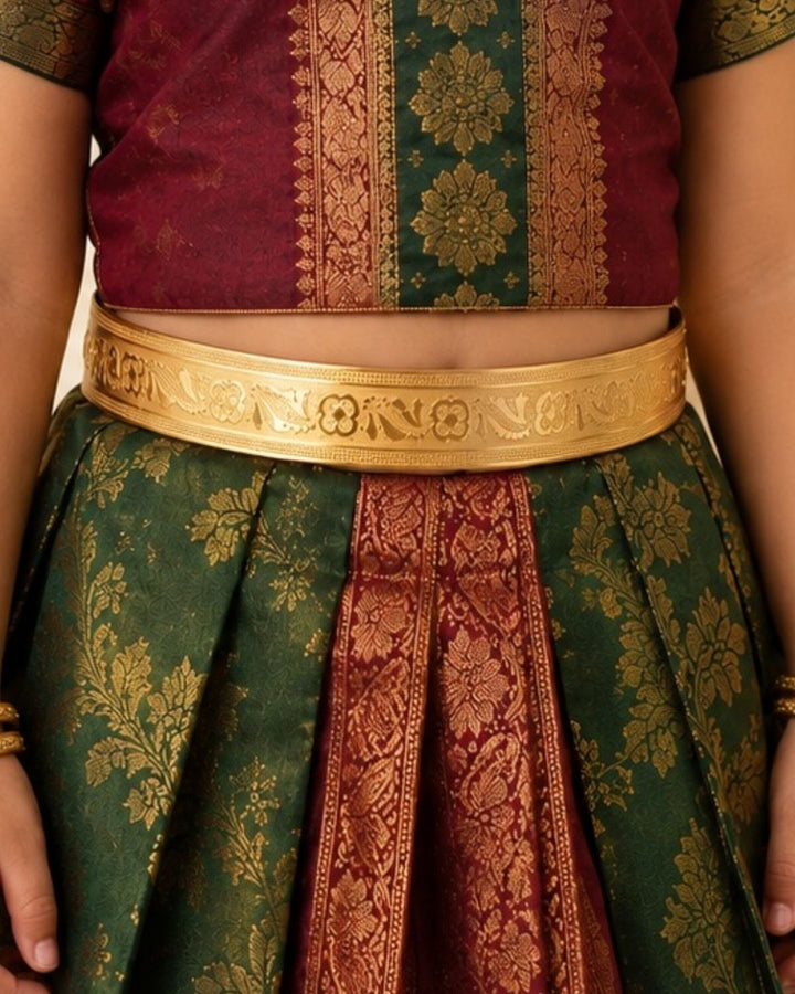 Beautiful gold plated kids’ hip belt featuring a wide engraved band with intricate floral and peacock-inspired detailing. Perfect for babies and kids, traditional wear, weddings, festive occasions, cultural events, and gifting.
