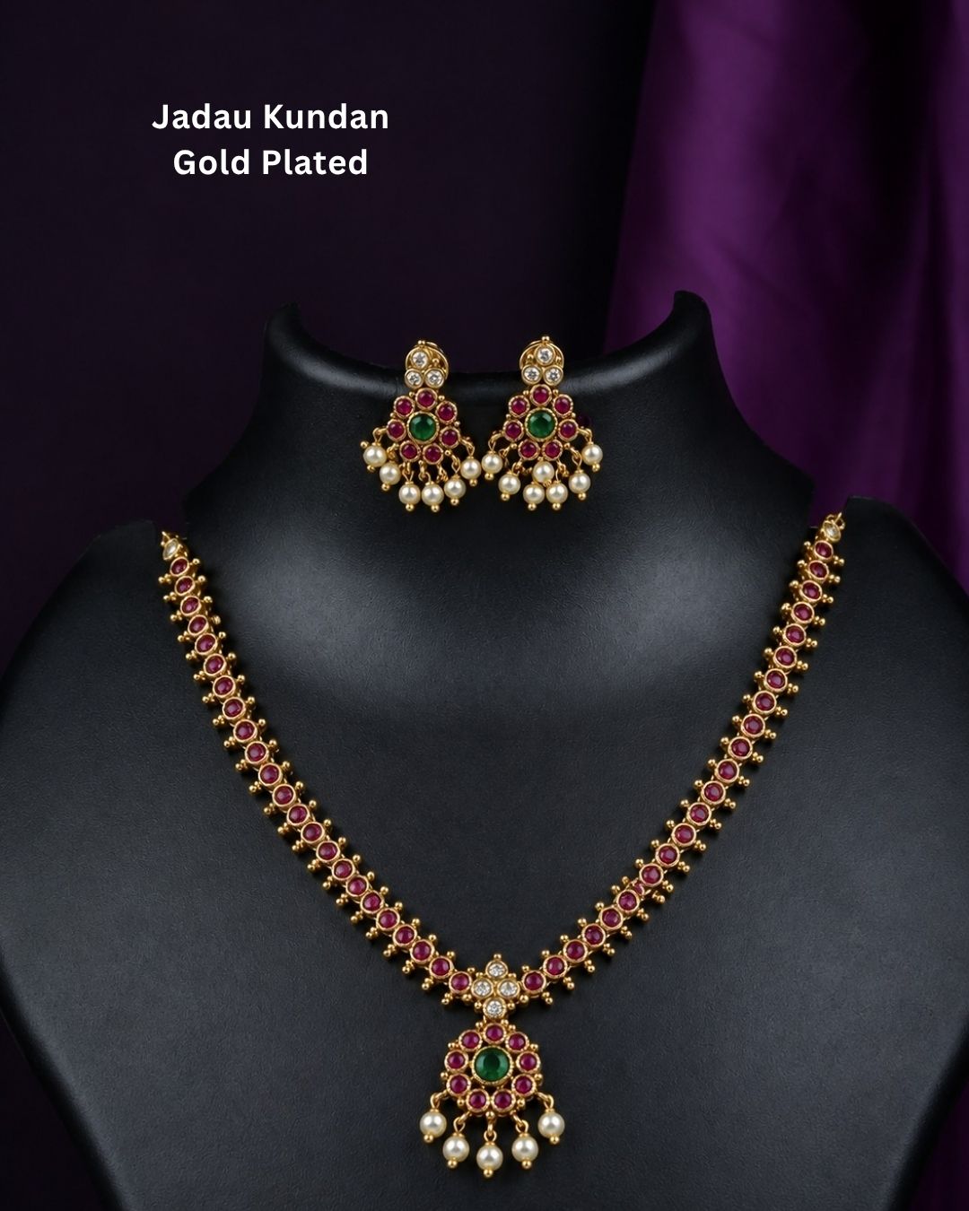 Beautiful Jadau Kundan gold plated necklace set featuring a ruby and green stone design, detailed Kundan work, and delicate pearl drops. Perfect for festive occasions, traditional outfits, weddings, parties, and gifting.