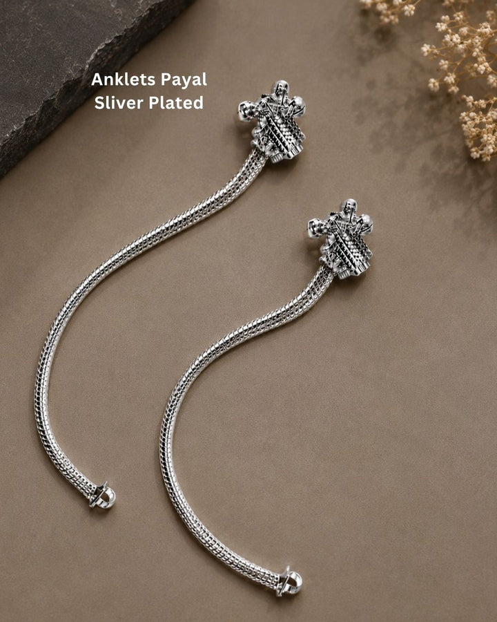 Beautiful silver plated kids payal set featuring delicate double-chain design and traditional silver charms. Perfect for babies, kids, festive occasions, traditional wear, and gifting.Beautiful silver plated kids payal