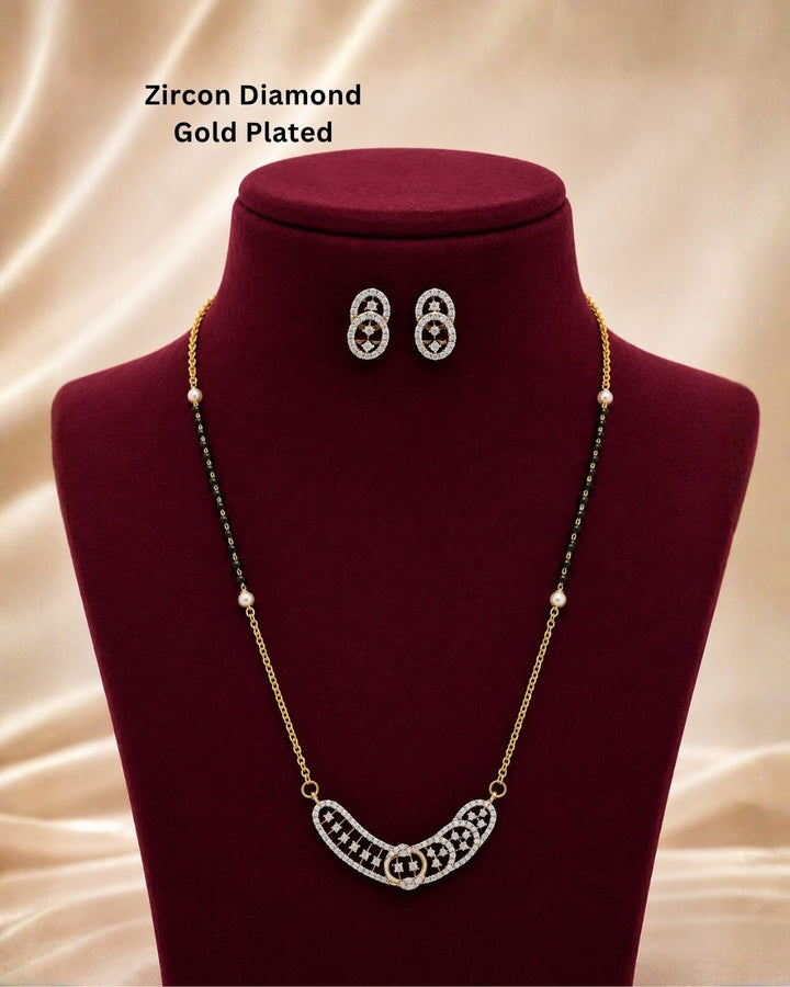 Beautiful black beads gold plated necklace set featuring a unique curved pendant embellished with sparkling stones and matching oval earrings, perfect for daily wear, festive occasions, parties, and gifting.