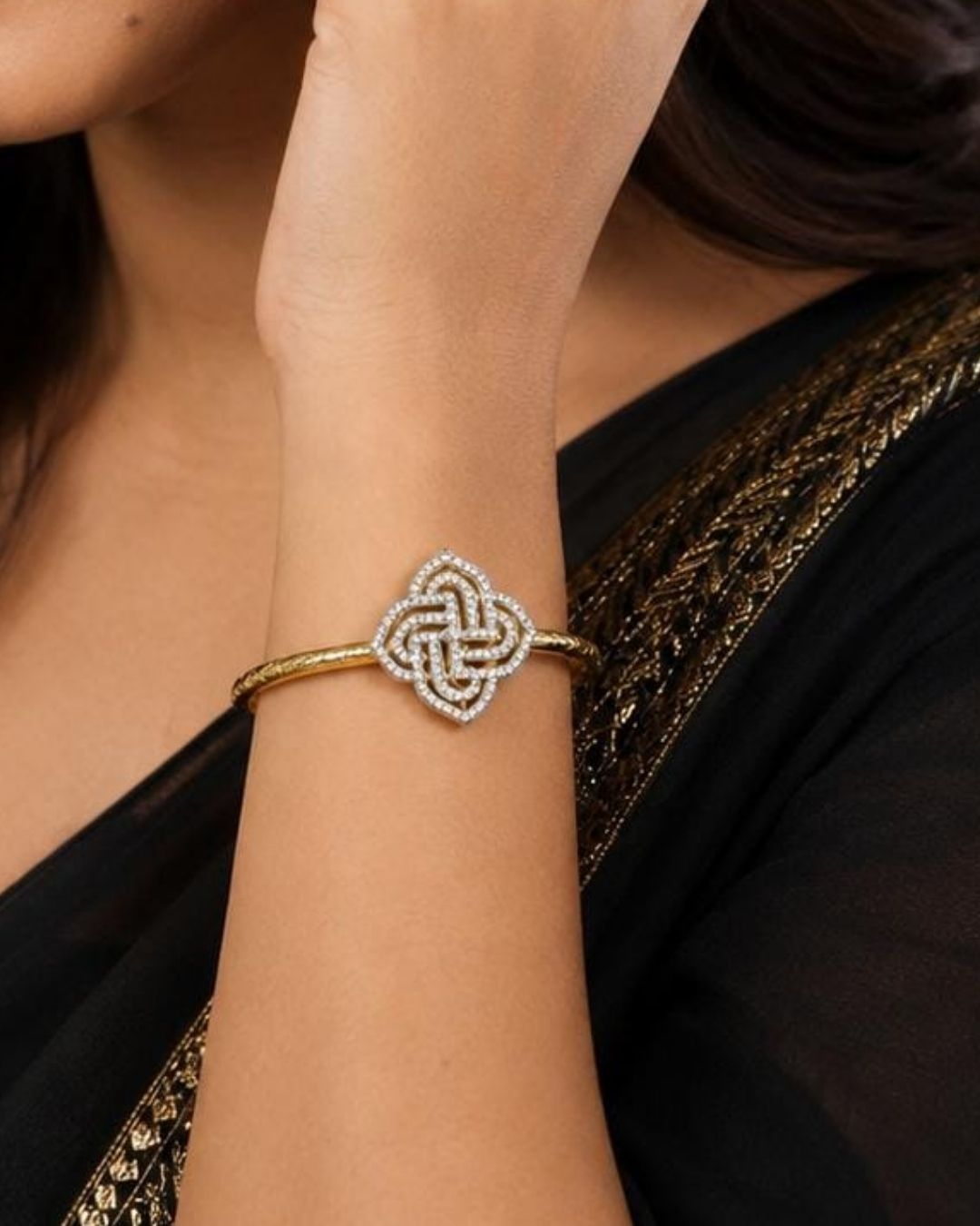 Beautiful gold plated designer kada pair featuring intricate peacock motifs embellished with sparkling CZ stones and subtle pink accents. Perfect for festive occasions, traditional wear, celebrations, and gifting.