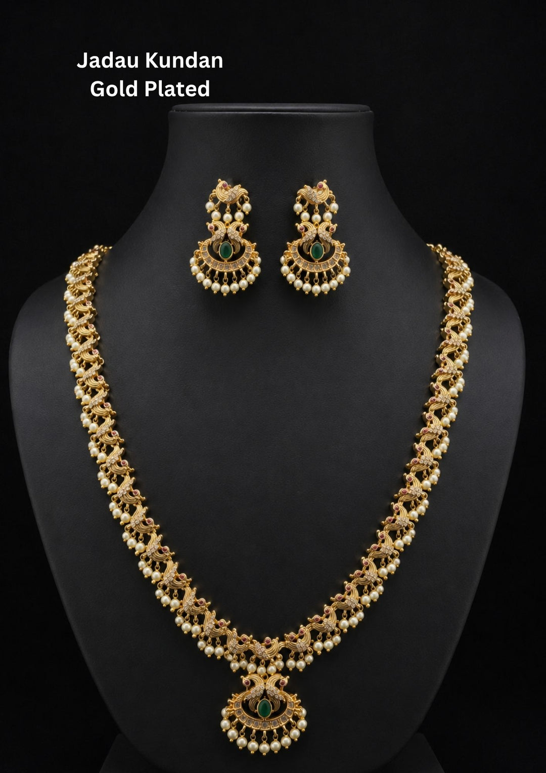 Elegant gold plated peacock temple necklace set featuring intricate peacock motifs, emerald green center stones, pearl drop detailing, and a beautifully crafted matching pendant with coordinated earrings. Perfect for weddings and festive occasions.